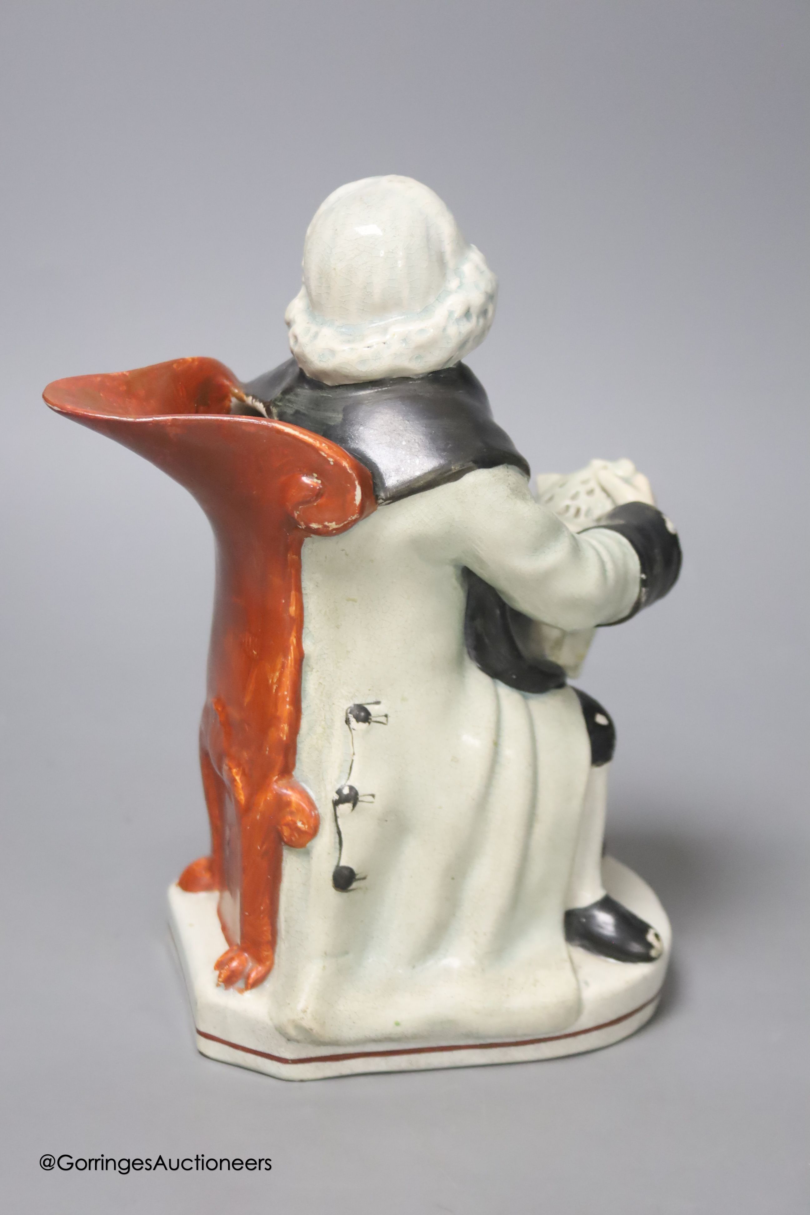 A Wood type pearlware seated Toby jug, height 20cm